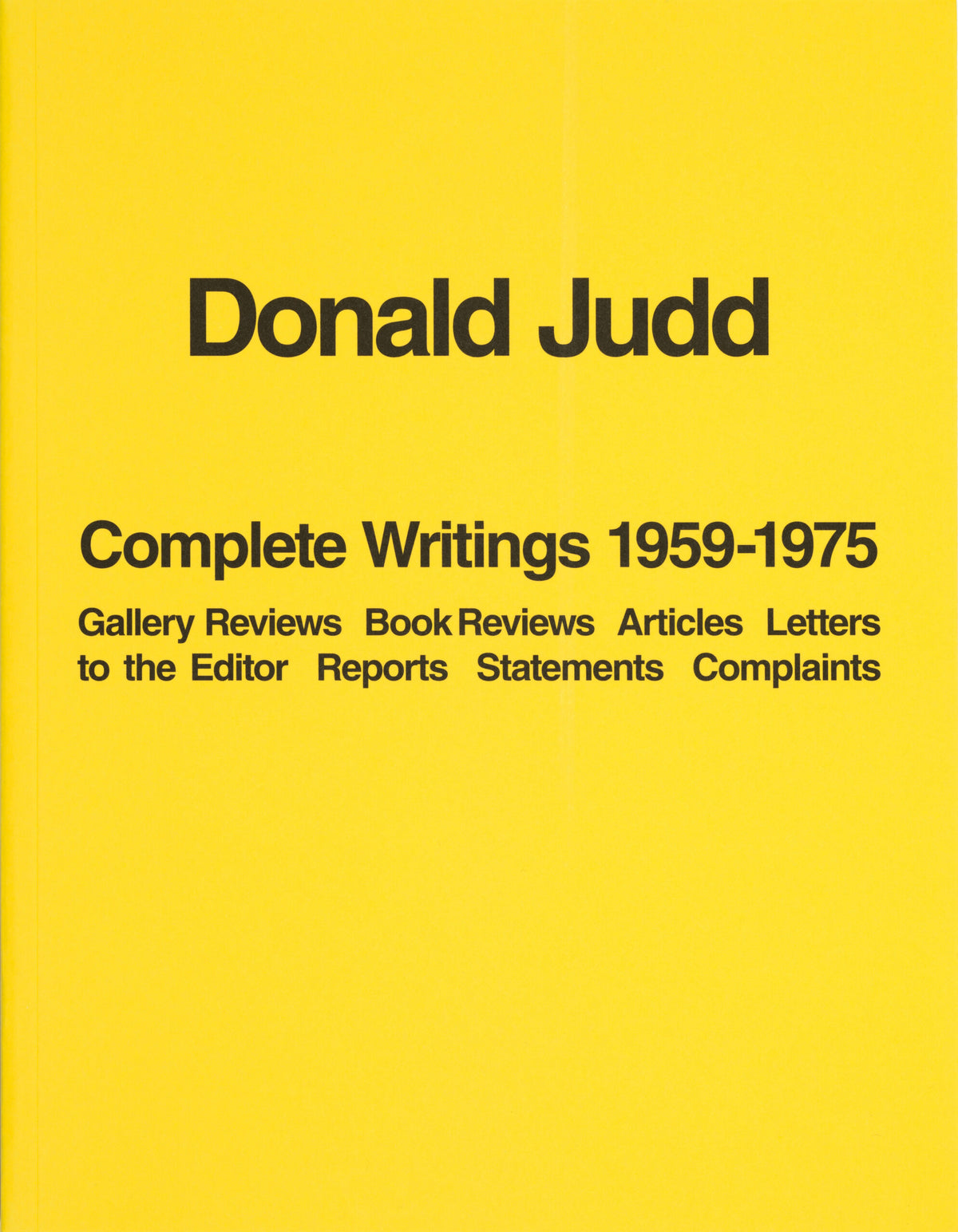 Donald Judd Complete Writings 1959-1975 book cover, bold black text on solid yellow background